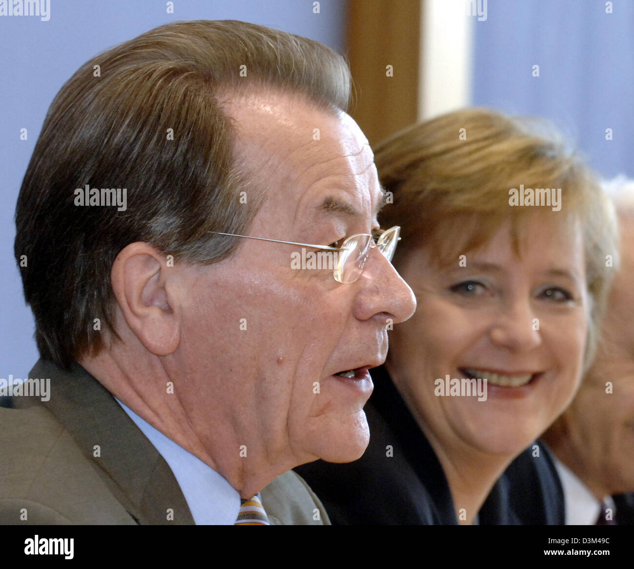 (dpa) - Angela Merkel, Chairwoman of the conservative Christian Democratic Union (CDU) and designated German Chancellor, looks at Franz Muentefering, outgoing Chairman of the Social Democrats (SPD) and designated Vice Chancellor, during a press conference concerning the coalition agreement in Berlin, Germany, 12 November 2005. The coalition agreement between parties which was discu Stock Photo