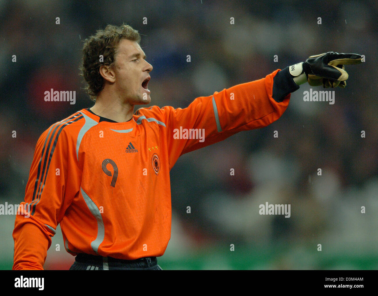 (dpa) German goalkeeper Jens Lehmann issues instructions in the