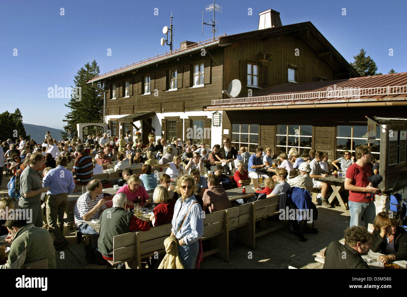 (dpa) - Hikers have a rest in 1,263 metres altitude at Neureuthaus restaurant at Neureut mountain near lake Tegernsee, Germany, 30 October 2005. Photo: Stephan Goerlich Stock Photo