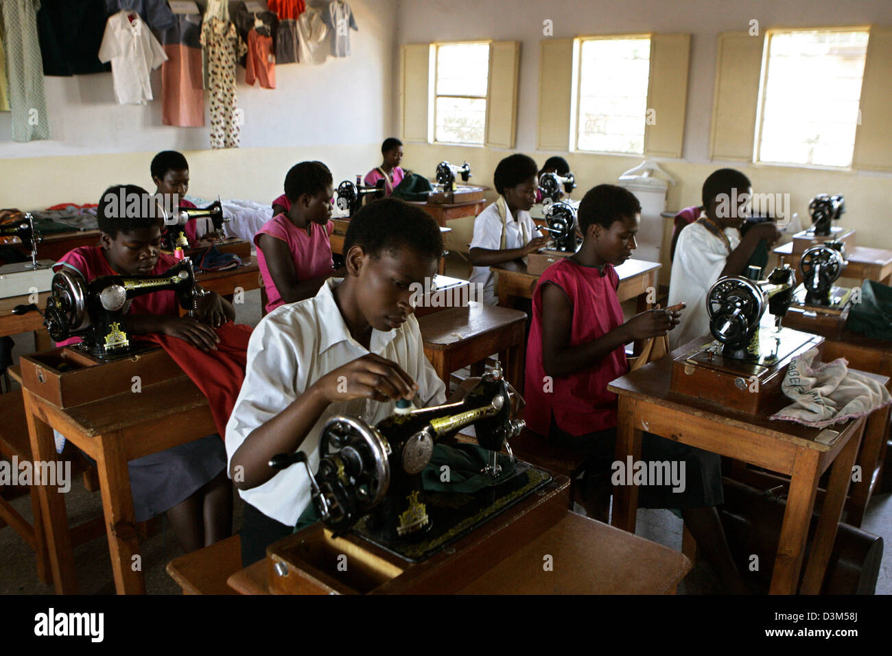 (dpa) The picture shows learners at a sewing class as preparation fpr a professional life in