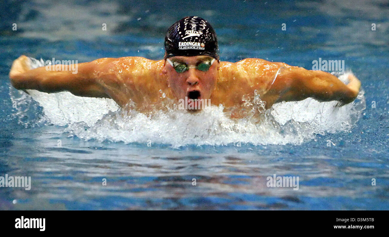 (dpa) - German swimmer Thomas Rupprath (28) in action in the men's 100m butterfly at the German championships in short distance swimming in Essen, Germany, Sunday, 27 November 2005. Rupprath clocked the second best lead time with 52,81 seconds. Rupprath won the German Championship in the men's 100m freestyle competition on Saturday, 26 November 2005 and with two more competitions a Stock Photo