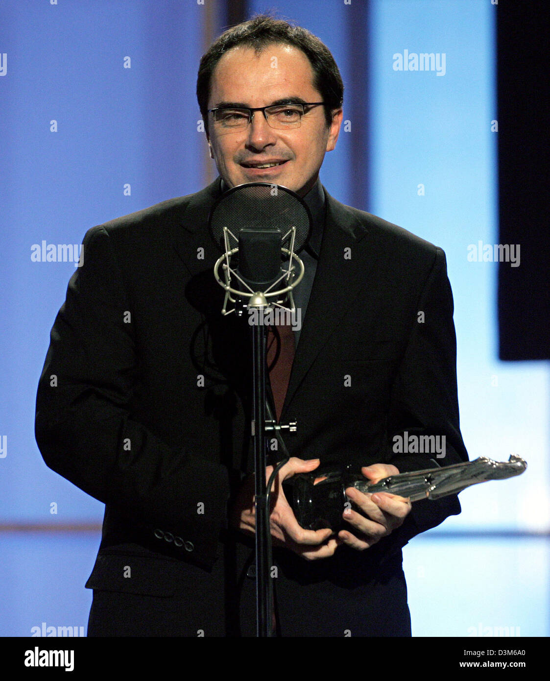 (dpa) - Composer Andrea Guerra receives an award for his 'Hotel Rwanda' soundtrack during the 18th European Film Academy Awards ceremony in Berlin, Germany, Saturday, 03 December 2005. The European Film Academy Award was awarded in 17 categories.  Photo: Marcus Brandt Stock Photo