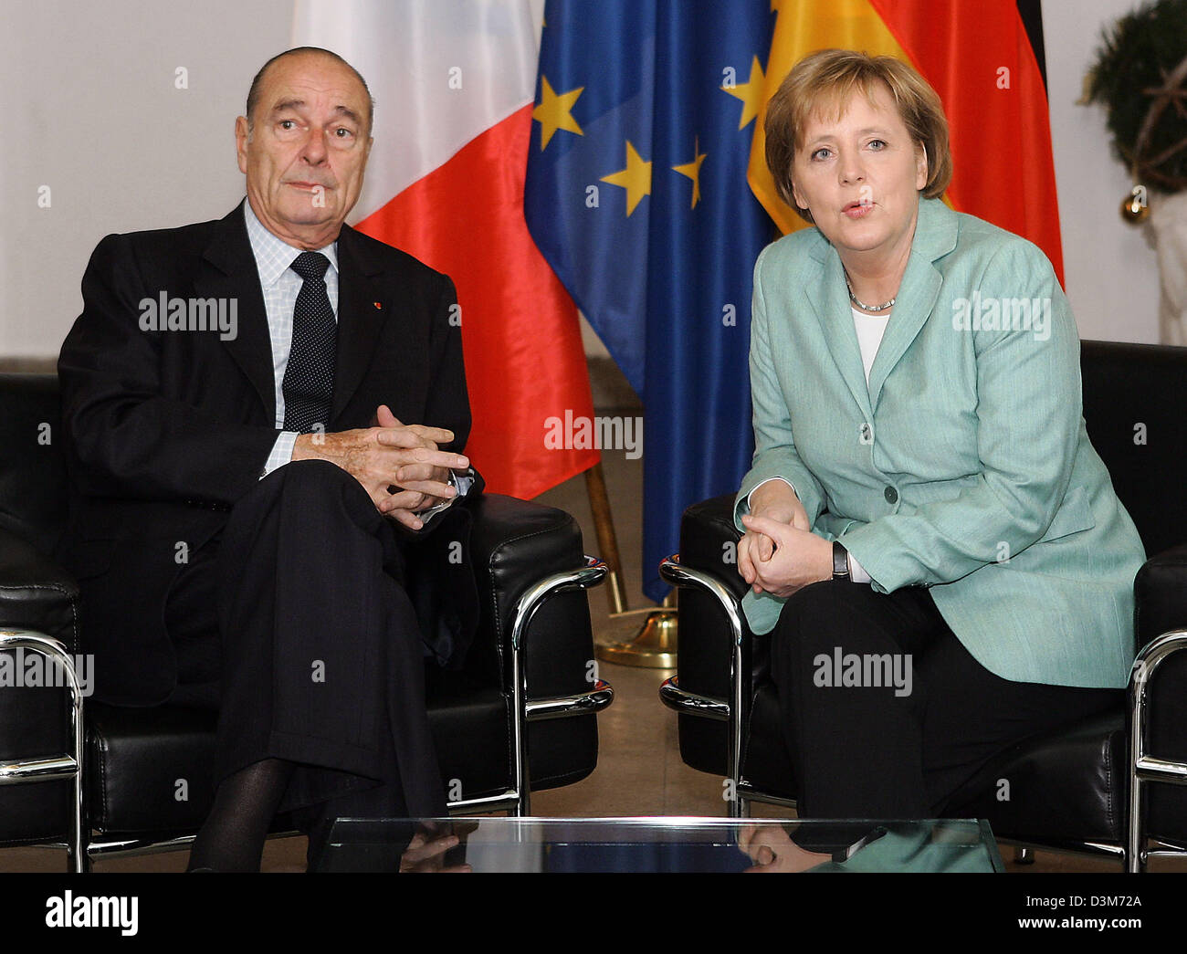 (dpa) - French President Jacques Chirac and German Chancellor Angela Merkel sit down for talks at Glienicke hunting seat, Berlin, Germany, 08 December 2005. It is Chirac's first visit to Germany since Merkel took office as chancellor. High on the agenda of discussions between the two leaders was the current row in Brussels over the future EU budget. Photo: Sean Gallup Stock Photo