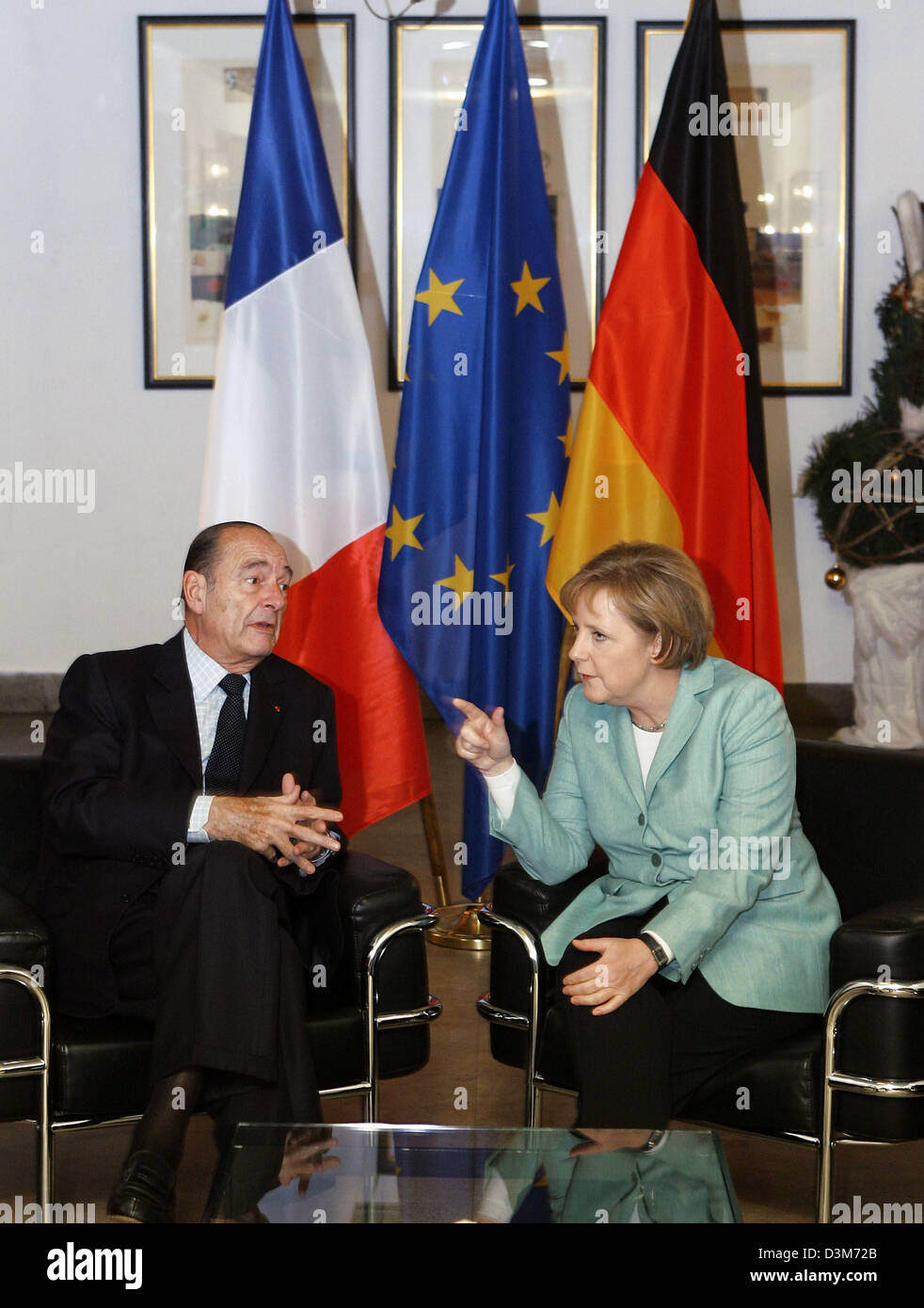 (dpa) - French President Jacques Chirac and German Chancellor Angela Merkel sit down for talks at Glienicke hunting seat, Berlin, Germany 08 December 2005. It is Chirac's first visit to Germany since Merkel took office as chancellor. High on the agenda of discussions between the two leaders was the current row in Brussels over the future EU budget. Photo: Sean Gallup Stock Photo