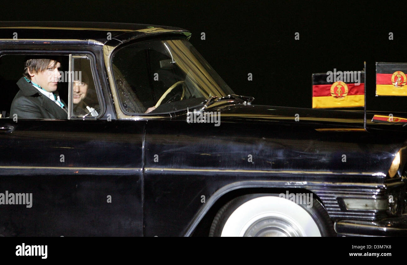 dpa) - Members of the German rock band 'Rammstein' arrive with a vintage  car featuring flags of the German Democratic Republic for the award  ceremony at the Olympic stadium in Berlin, Germany,