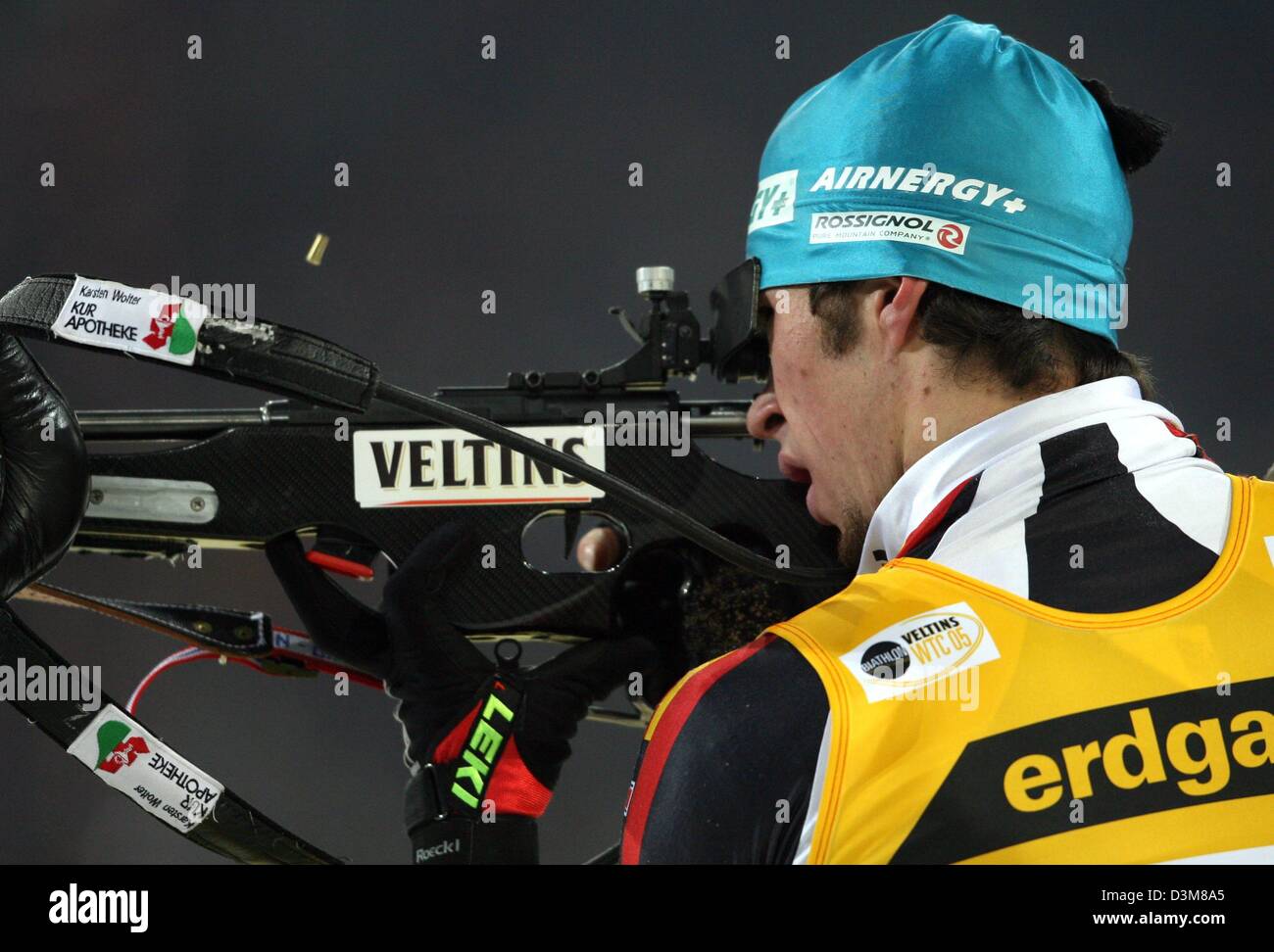 (dpa) - German biathlete newcomer Christoph Knie amis with his rifle during the Biathlon World Team Challenge at the Veltins-Arena in Gelsenkirchen, Germany, Friday, 30 December 2005. Around 2,500 cubic metres of artificial snow were delivered on 120 trucks from the indoor ski venue in Neuss, Germany, to the Veltins-Arena to build a 1,000 metre long cross-country ski run for the co Stock Photo