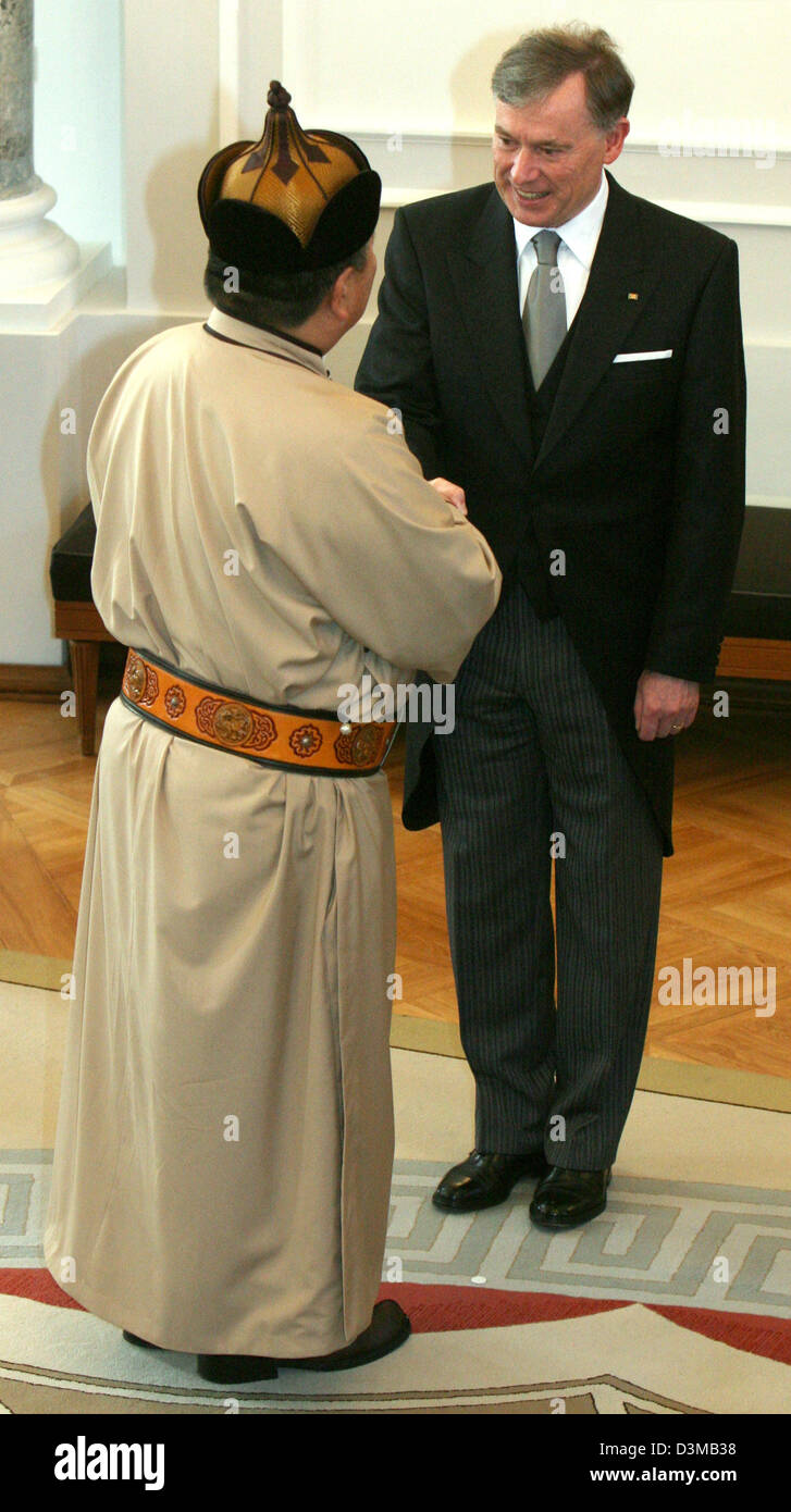 (dpa) - German President Horst Koehler (R) welcomes Mongolian ambassador Tuvdendorj Galbaatar to the traditional New Year reception of the diplomatic corps at Schloss Bellevue in Berlin, Thursday, 12 January 2006. representatives of more than 150 countries attended the event. Photo: Tim Brakemeier Stock Photo