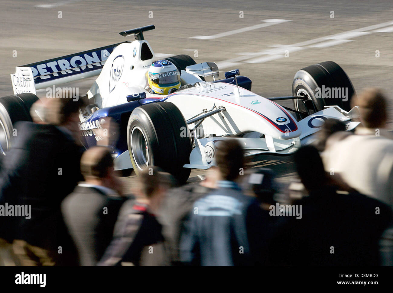 (dpa) - German Formula One pilot Nick Heidfeld pictured speeding his new BMW Sauber F1 Team race car 'F1.06' during the first rollout at the race track of Valencia, Spain, Tuesday 17 January 2006. Photo: Gero Breloer Stock Photo