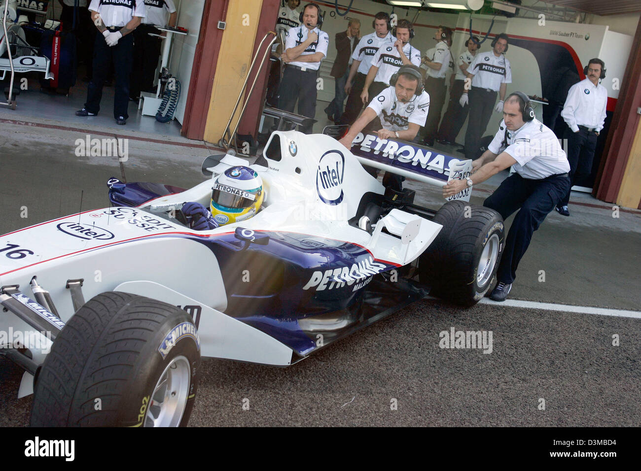 (dpa) - German Formula One pilot Nick Heidfeld is puuled back into the pits in his new BMW Sauber F1 Team race car 'F1.06' after the first rollout at the race track of Valencia, Spain, Tuesday 17 January 2006. Photo: Gero Breloer Stock Photo