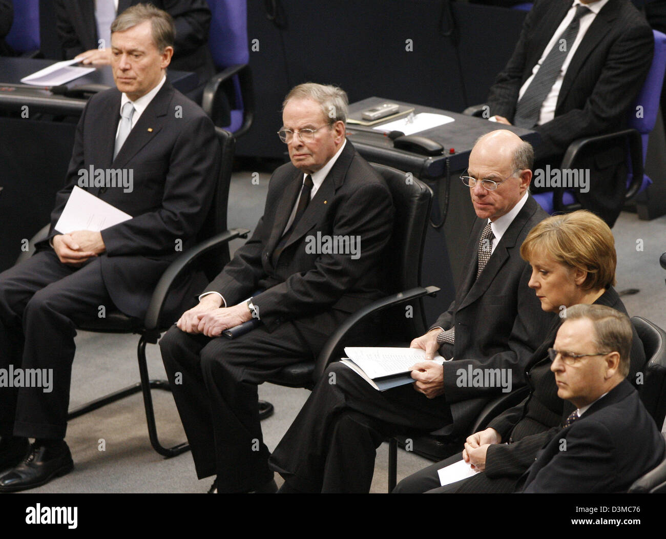 German President Horts Koehler, publicist and Holocaust survivor Ernst Cramer, President of the Bundestag Norbert Lammert, Federal Chancellor Angela Merkel and President of the Federal Constitutional Court Hans-Juergen Papier (L-R) sit in the plenar hall of the Reichstag building in Berlin, Germany, Friday 27 January 2006. The German Bundestag commemorated the victims of National S Stock Photo