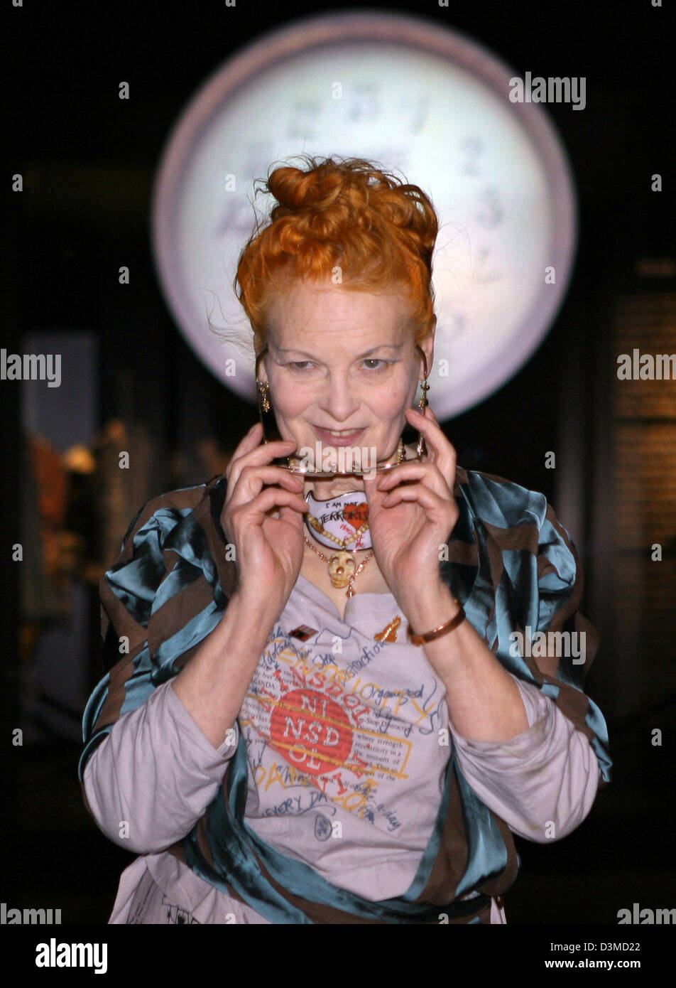 British fashion designer Vivienne Westwood pictured at the exhibition centre 'NRW-Forum Kultur und Wirtschaft' in Duesseldorf, Germany, Friday, 03 Feburary 2006. In the background a backwards running clock, which used to hang above Westwood's first shop. Vivienne Westwood arrived for a press conference regarding her exhibition featuring a retrospective of her women's fashion design Stock Photo