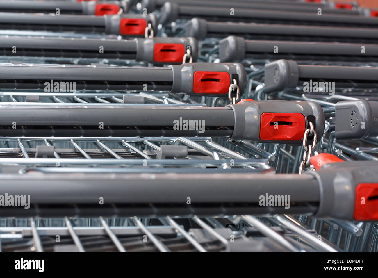 Rows of unbranded shopping carts at the hypermarket Stock Photo