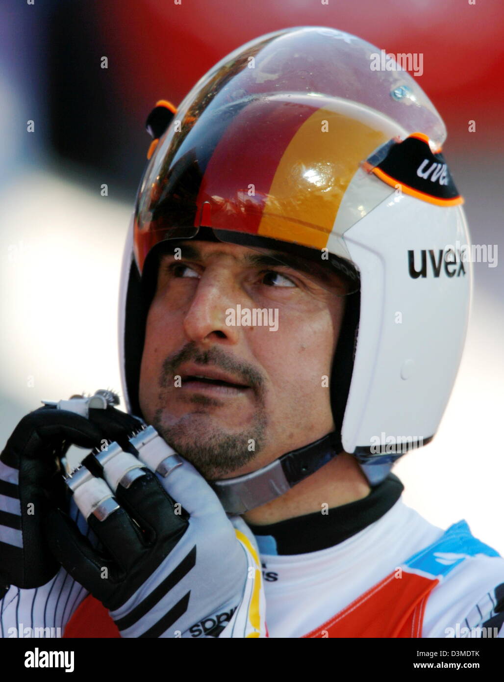 German triple gold medal winner Georg Hackl takes of his helmet after his first run at the Olympic luge track in Cesana Pariol, Italy, Saturday 11 February 2006. Taking fifth place after two of four runs his sixth Olympic medal lies still within reach. Italian gold favourite Armin Zoeggler clocked fastest time. Photo: Arne Dedert Stock Photo
