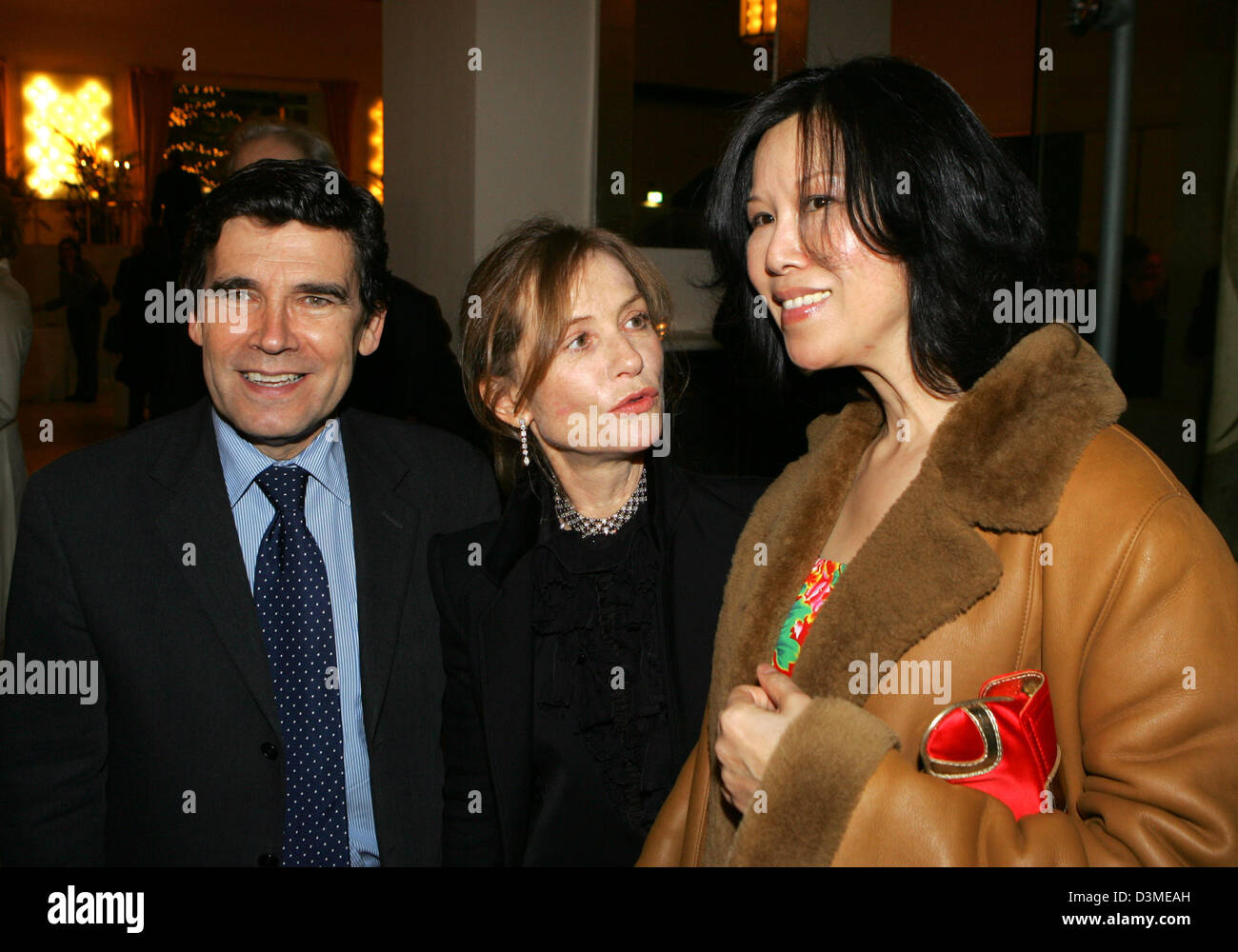 French ambassador Claude Martin and his wife Judith (R) are pictured with French actress Isabelle Huppert during the party for the premiere of the film 'L'Ivresse Du Pouvoir' at the 56th International Film Festival in Berlin, Thursday, 16 February 2006. The film runs in the competition at this year's film festival. Photo: Jens Kalaene Stock Photo