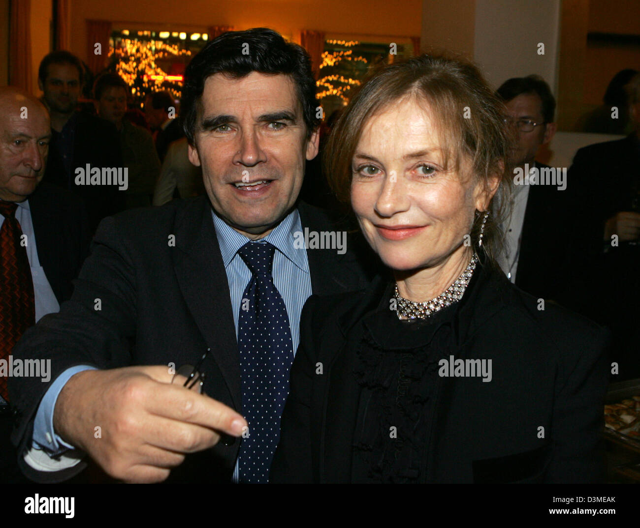 French ambassador Claude Martin and French actress Isabelle Huppert are pictured during the party for the premiere of the film 'L'Ivresse Du Pouvoir' at the 56th International Film Festival in Berlin, Thursday, 16 February 2006. The film directed by Claude Chabrol runs in the competition at this year's film festival. Photo: Jens Kalaene Stock Photo