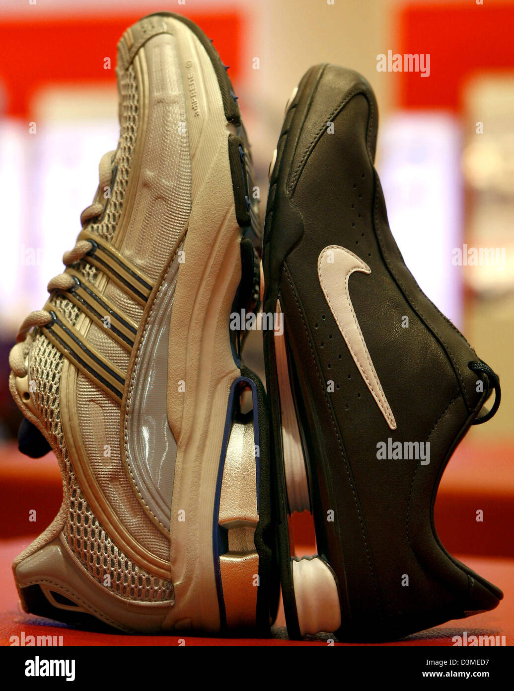 A model with 'SHOX Cushioning Technology' by Nike (R) stands on a model  with the 'a3' cushioning system by adidas in Nuremberg, Germany, Friday 17  February 2006. Nike claimed a patent infringement