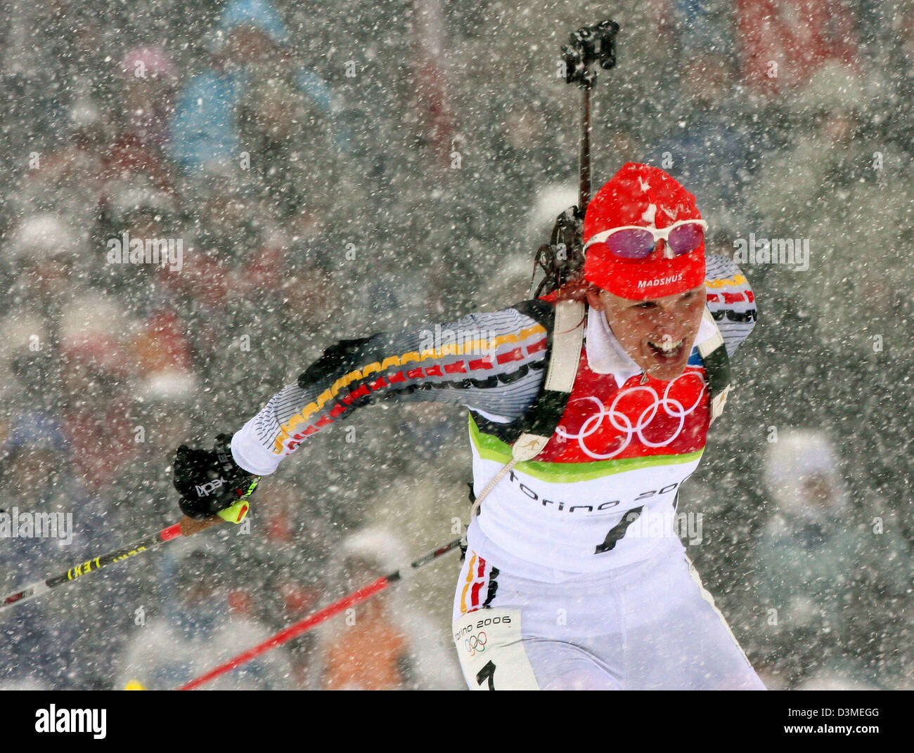 (dpa) - German biathlete Kati Wilhelm photographed while it snows during the women's 10km pursuit race at the Olympic track in San Sicario, Italy, Saturday 18 February 2006. Wilhelm won gold. Photo: Martin Schutt Stock Photo