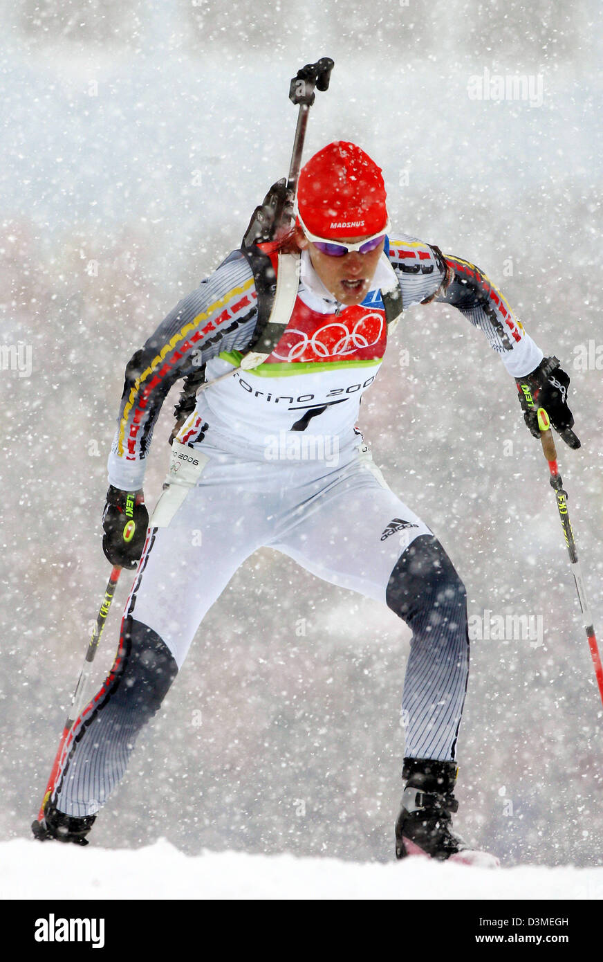 (dpa) - German biathlete Kati Wilhelm photographed while it snows during the women's 10km pursuit race at the Olympic track in San Sicario, Italy, Saturday 18 February 2006. Wilhelm won gold. Photo: Bernd Thissen Stock Photo