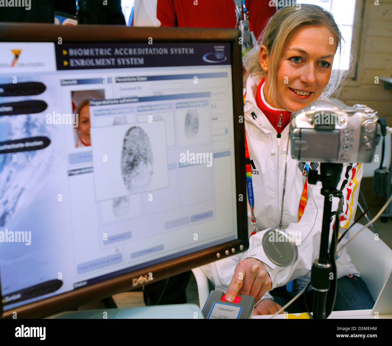 Biometric data of German luger Sylke Otto, Slat Lake City 2002 Olympic champion, is saved during the accreditation for the German house at the Olympic Village in Sestrieres, Italy, Thursday 09 February 2006. Afterwards Otto answered journalist's questions during a press conference. The grand opening of the XX Olympic Winter Games in Turin takes place on Friday, 10 February 2006. Ph Stock Photo
