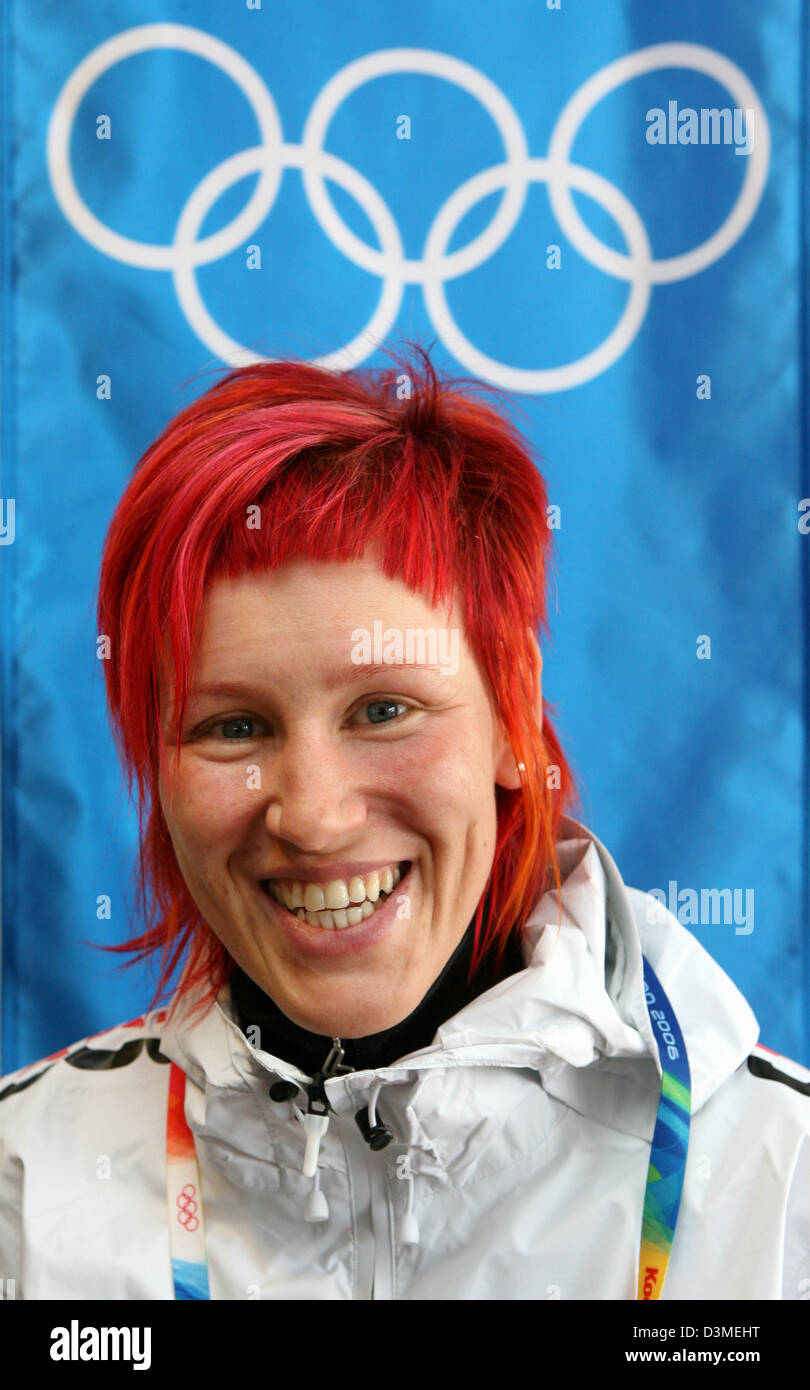 German biathlete Kati Wilhelm, Salt Lake City 2002 double Olympic champion, laughs during a press conference in San Sicario near Turin, Italy, Thursday 09 February 2006. On Friday, 10 February 2006, Wilhelm will carry the German flag into the Stadio Comunale stadium for the grand opening of the XX Olympic Winter Games in Turin takes place. Photo: Martin Schutt Stock Photo