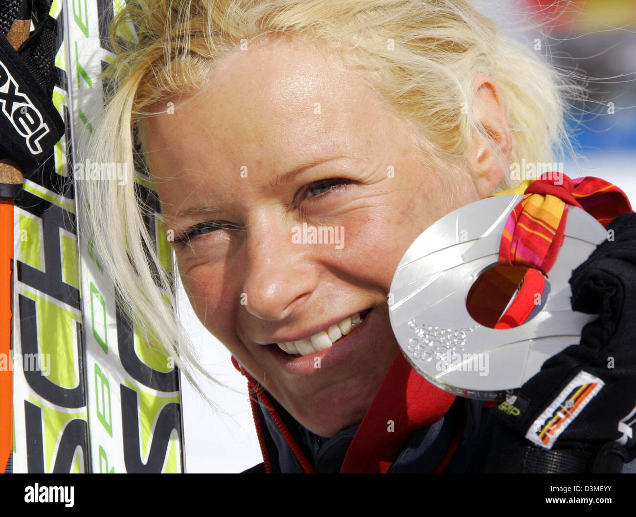 German cross-country skier Claudia Kuenzel presents her silver medal after coming in second in the Women's 1.1 km Cross-Country Sprint event at the Turin Winter Olympics in Pragelato Plan, Italy, Wednesday, 22 February 2006. Photo: Bernd Thissen Stock Photo