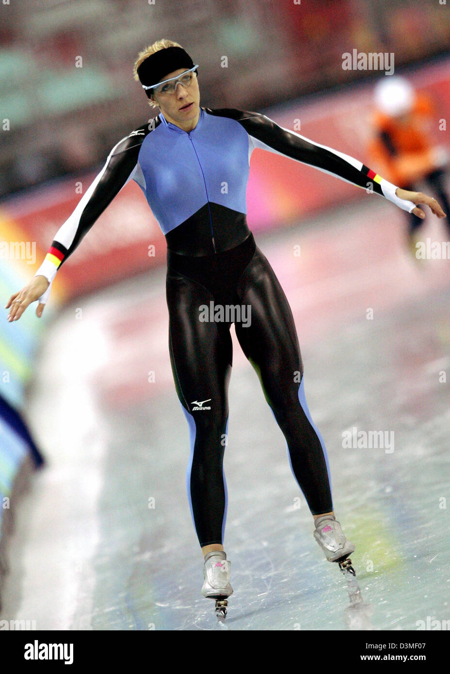 German speed skater Anni Friesinger conducts a stretching exercise during a practice session on the ice rink at the Turin Winter Olympics in Turin, Italy, Wednesday, 22 February 2006.  Friesinger won bronze in the Women's 1,500 metre Speed Skating event. Photo: Frank May Stock Photo