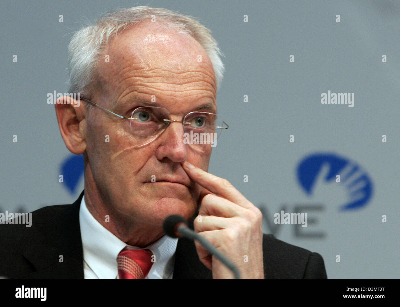 RWE AG chief of finance Klaus Sturany touches his face during the energy giant's balance press conference in Essen, Germany, Thursday, 23 February 2006. According to Roels the results for 2005 are positive. Photo: Roland Weihrauch Stock Photo