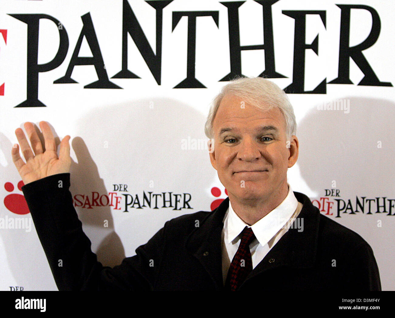 US actor Steve Martin poses in front of a poster wall for his new film 'The Pink Panther' during a photocall in Berlin, Friday, 24 February 2006. The film will be released in Germany on 09 March 2006. Photo: Jens Kalaene Stock Photo
