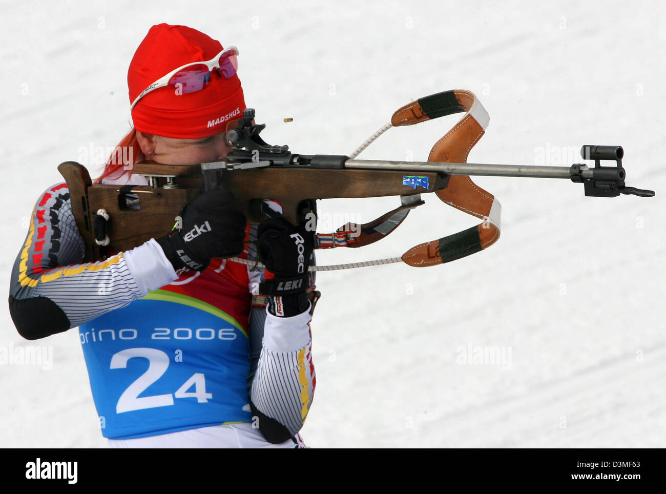 German biathlete Kati Wilhelm aims with her rifle as she stands at the shooting range in the Women's 4 x 6km Biathlon Relay at the Olympic Winter Games in San Sicario, Italy, Thursday, 23 February 2006. The German team won silver. Photo:  Martin Schutt Stock Photo