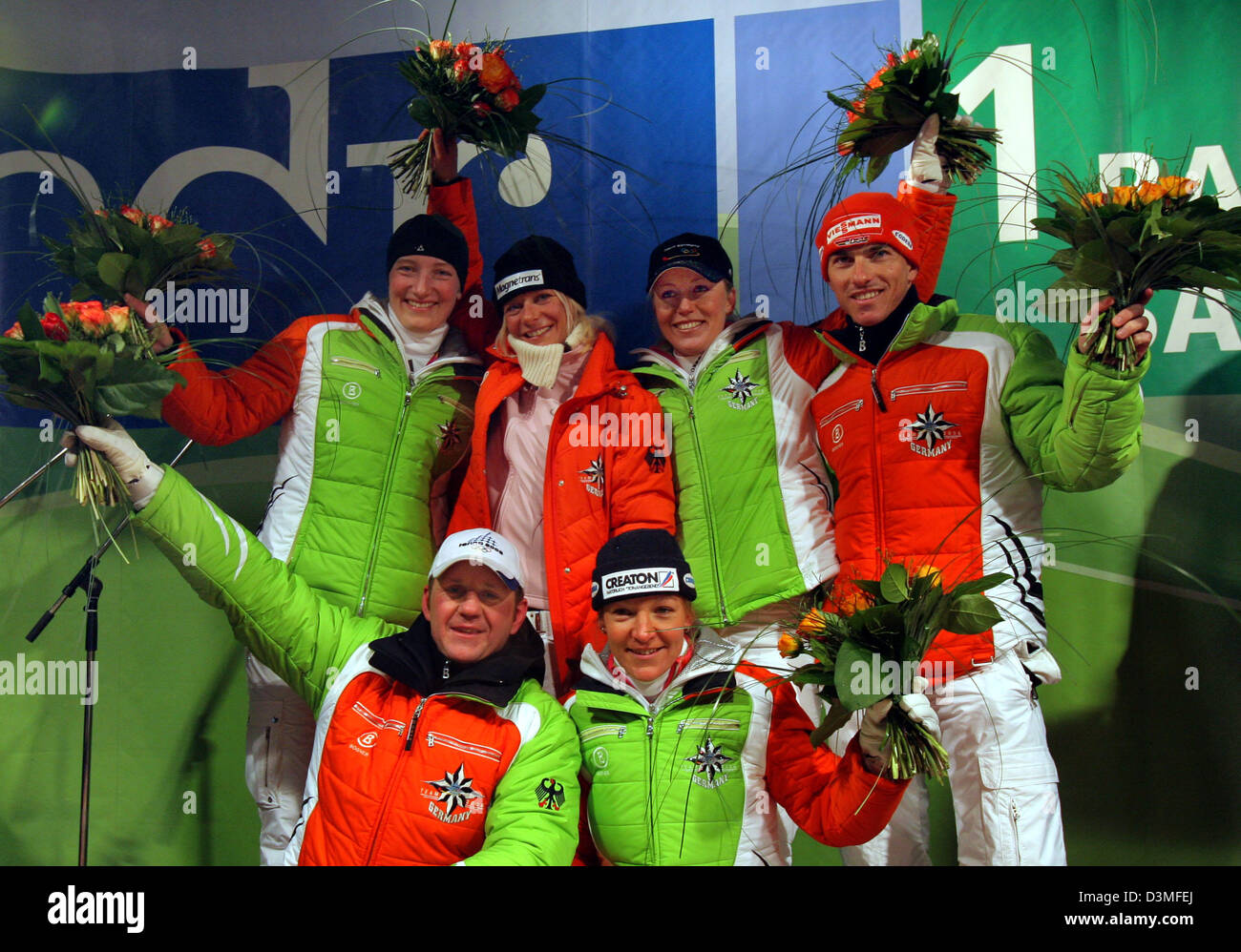 Olympic medal winners from Saxony including silver medalist in two-men luging Torsten Wustlich (front) and cross-country skier Viola Bauer as well as (back, from L) bronze medalist in luging Tatjana Huefner, silver medalist in cross-country skiing Claudia Kuenzel , gold medalist in luging Sylke Otto and silver medalist in the men's cross-country skiing event Rene Sommerfeldt cheer  Stock Photo