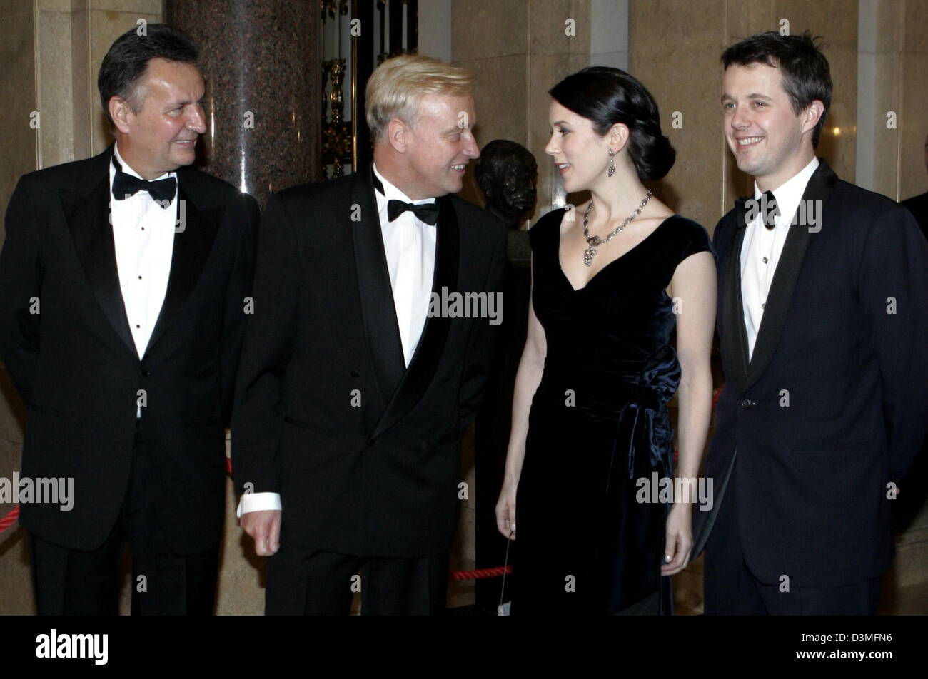 Denmark's Crown Prince Frederik (R) and his wife Crown Princess Mary (2nd R) stand next to Hamburg's mayor Ole von Beust (CDU) and Michael Frenzel (L), chairman of tourism company TUI,  ahead of the traditional Matthiae meal at the town hall in Hamburg, Germany, Friday, 17 February 2006. The Danish Crown Prince and Crown Princess were invited as guest of honour to the traditional m Stock Photo