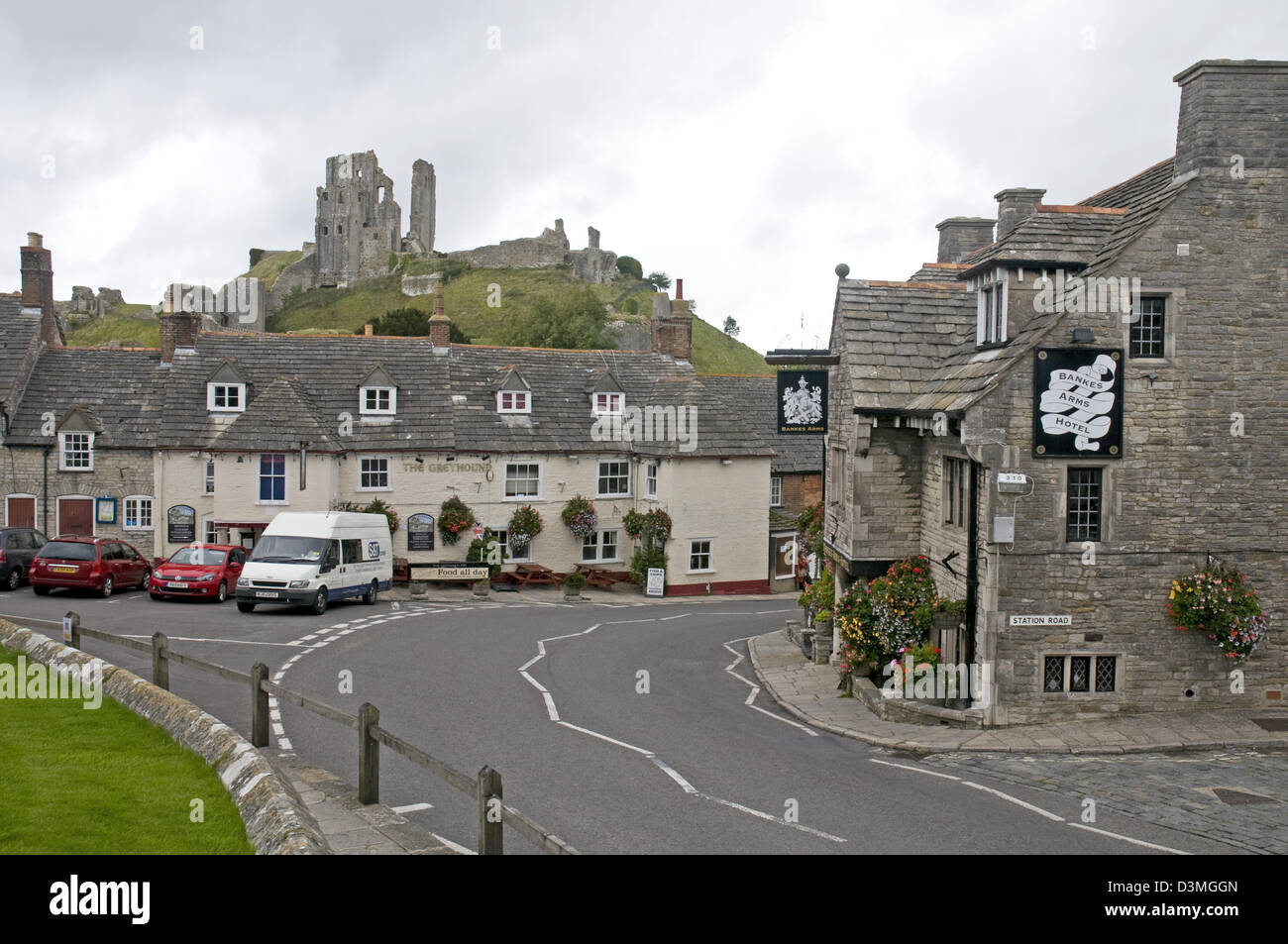 The Dorset village of Corfe Castle, with the castle itself perched on the distant hill Stock Photo