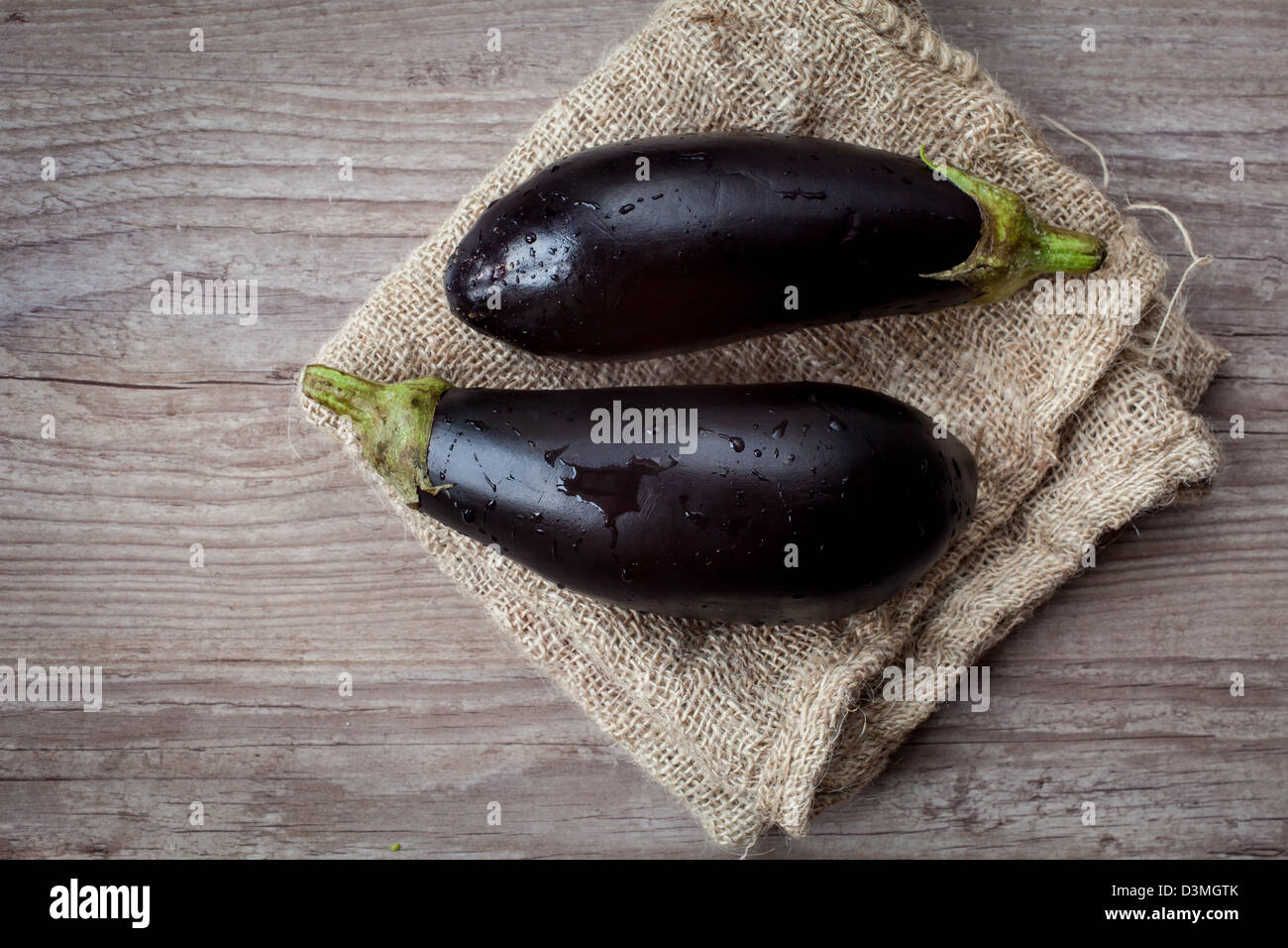 Assortment of fresh eggplant on wooden background Stock Photo