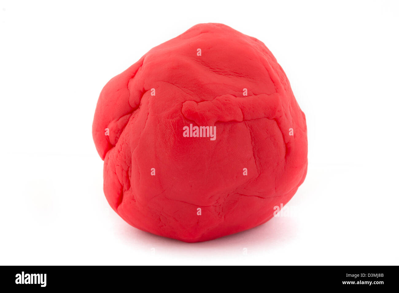 Ball of red play dough over white Stock Photo