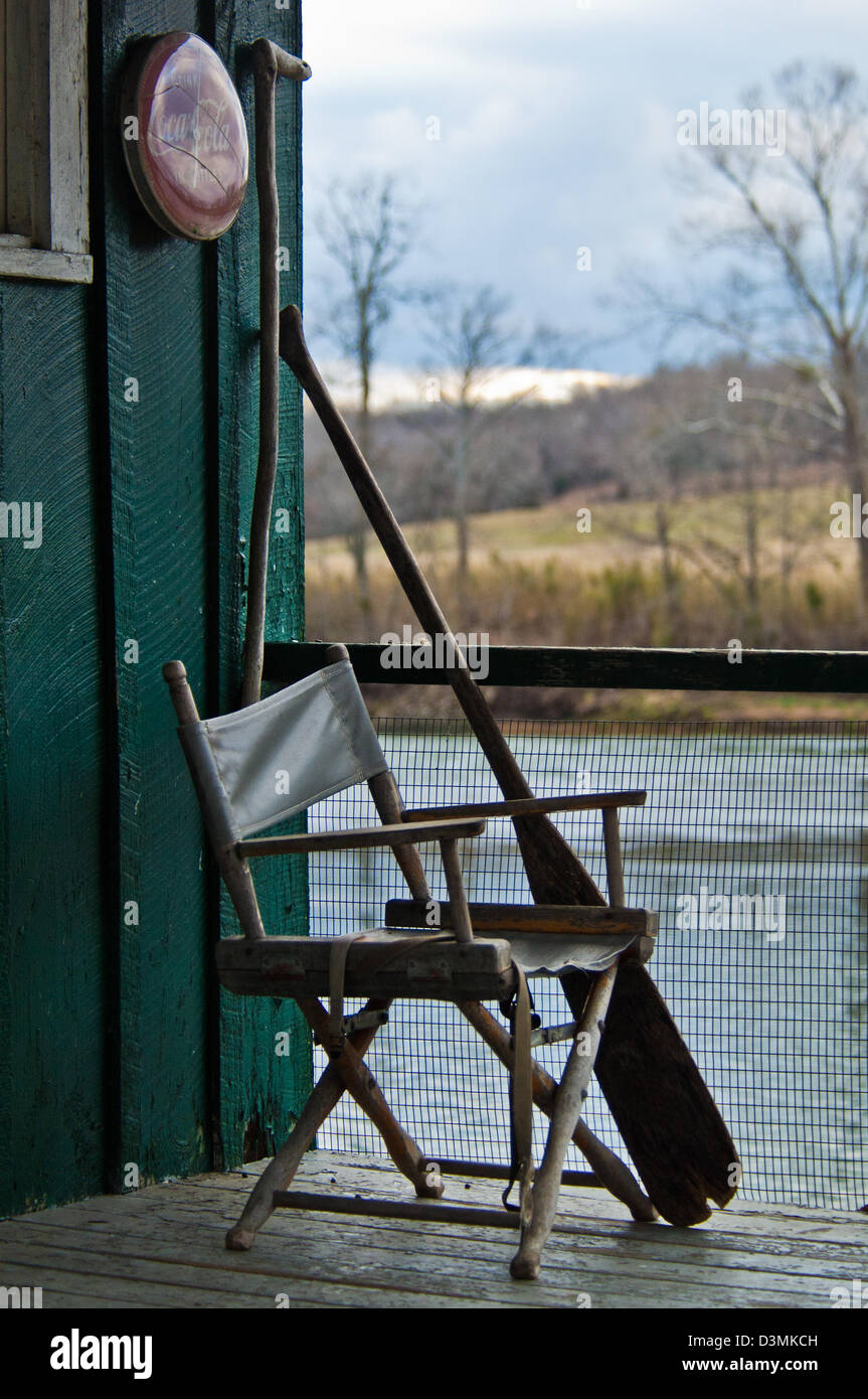 Deck chair and boat paddle at an old bait shop on the White River