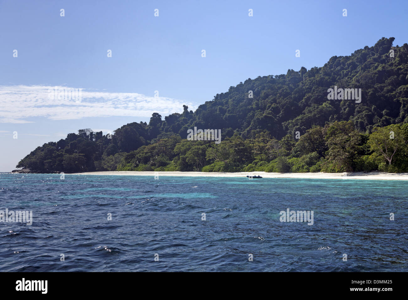 Thai island of Koh Tachai from the Andaman Sea showing tropical rainforest and white sands Stock Photo