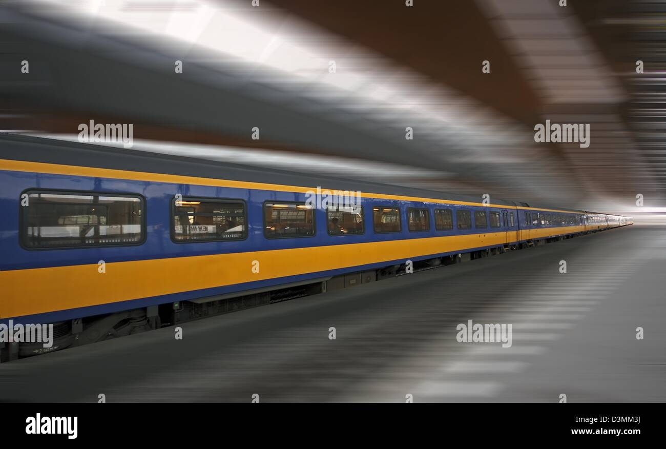 Fast train running through Bijlmer station Stock Photo