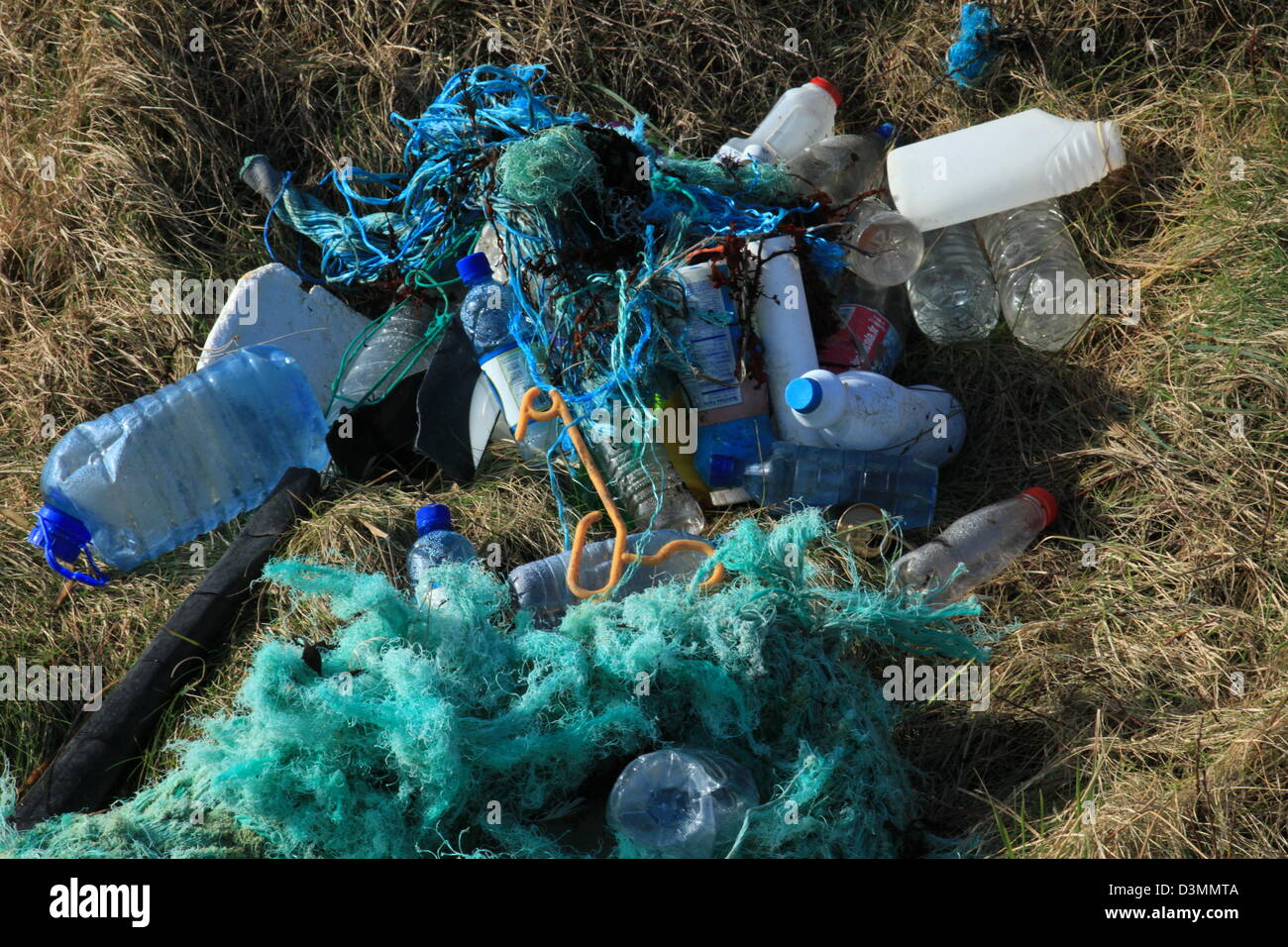 large thick plastic rope and plastic containers shredded by motion of a