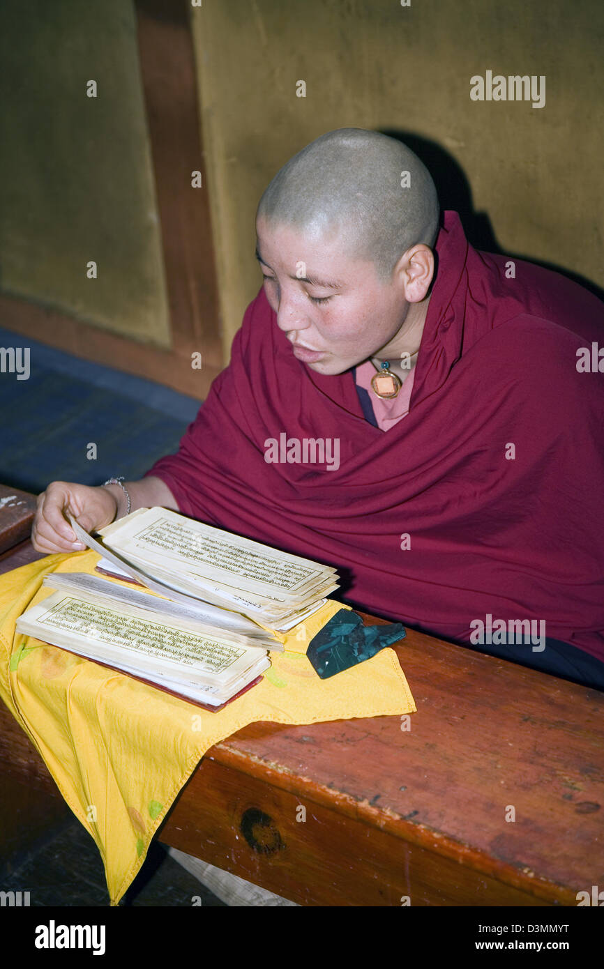 A Buddhist nun sings prayer songs at the Zilukha Nunnery at Drubthob Goemba in Thimphu, Bhutan, Asia Stock Photo