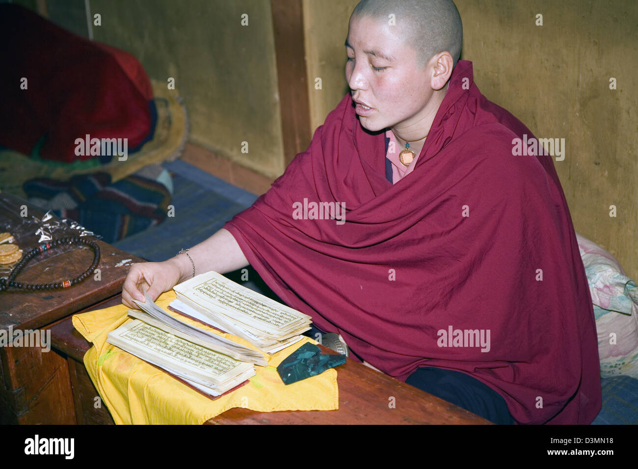 A Buddhist nun sings prayer songs at the Zilukha Nunnery at Drubthob