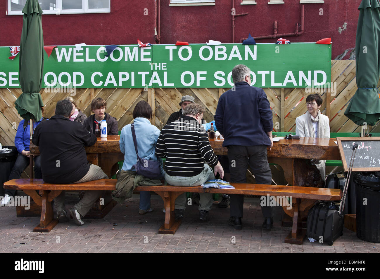 Oban, Scotland, quayside dining alfresco on the town wharf of Oban ...