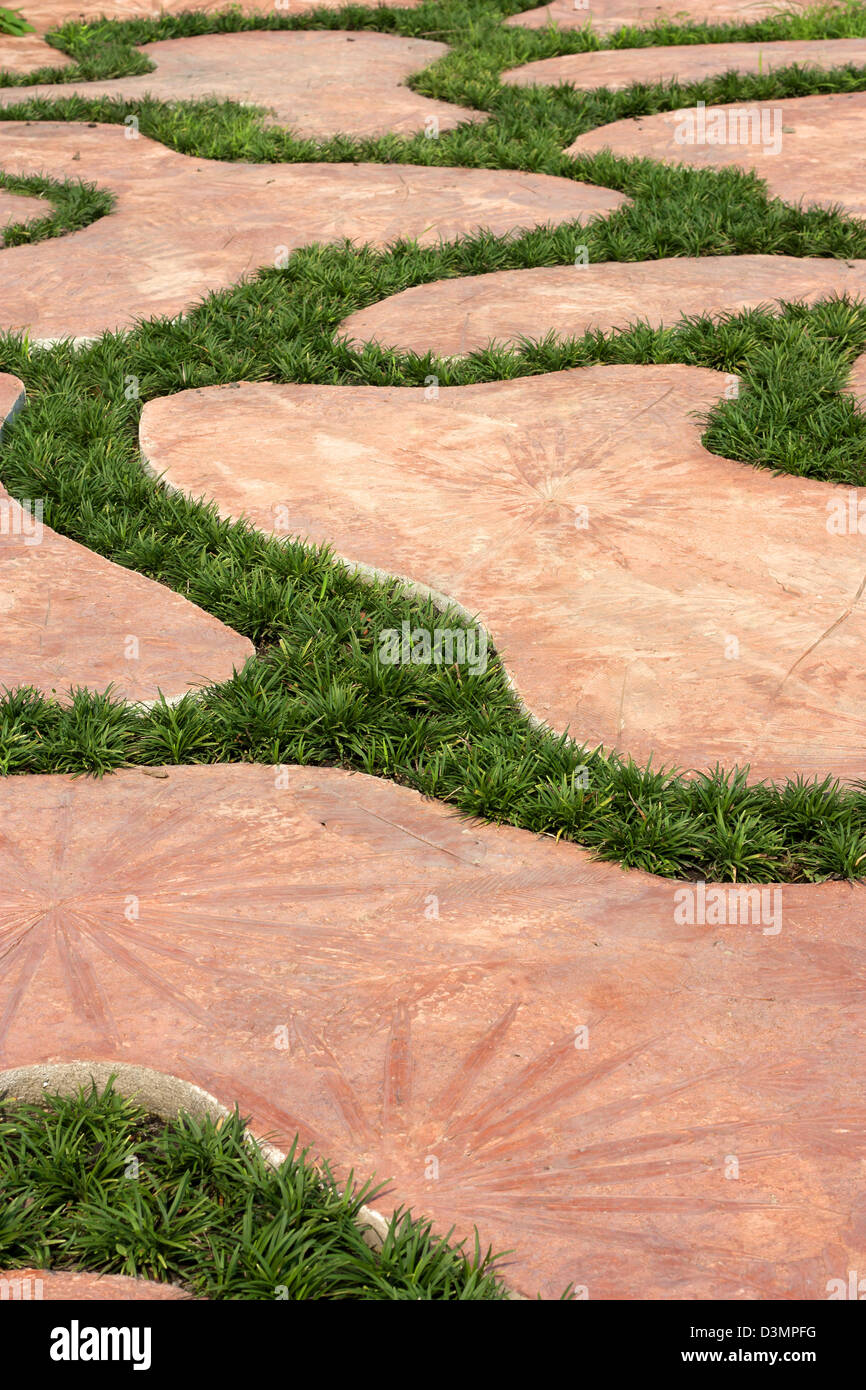 Cement walkways decorated with grass and beautiful. Parks. Stock Photo