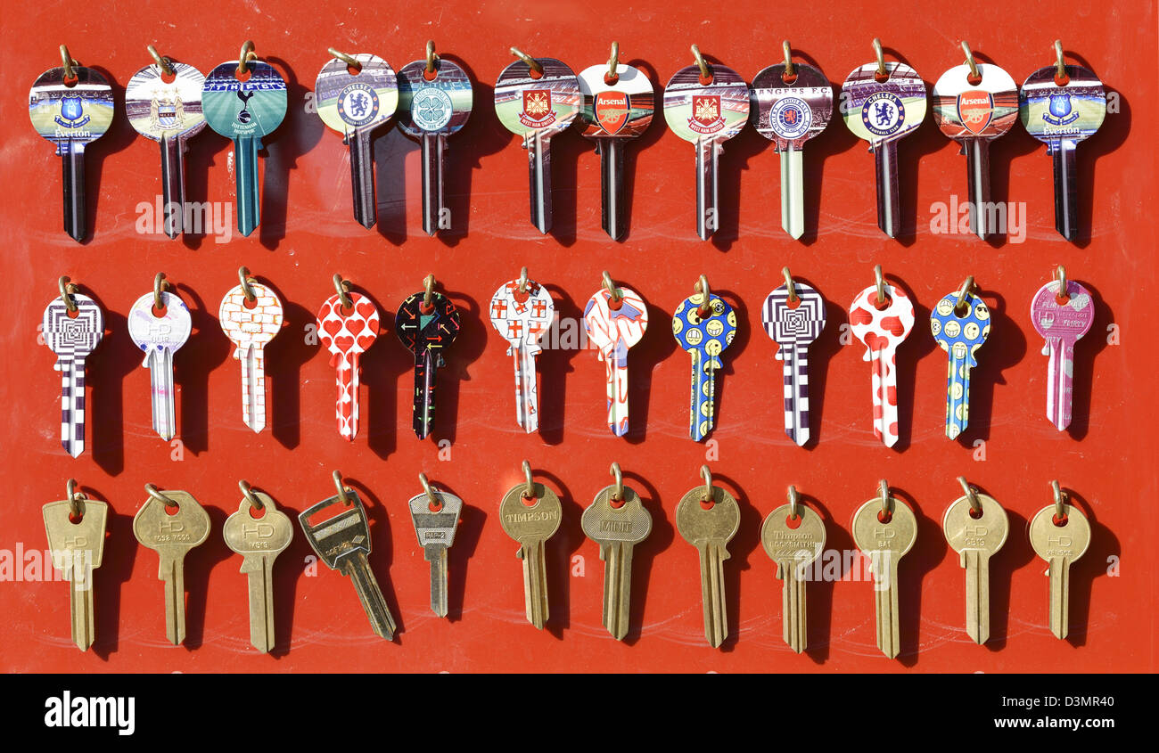 House keys hanging on hooks Stock Photo