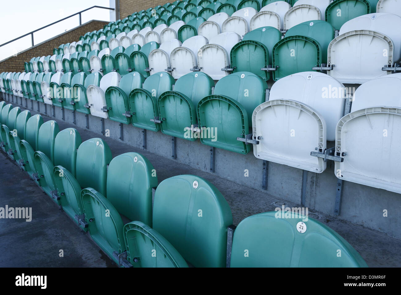 White and green plastic stadium seating Stock Photo