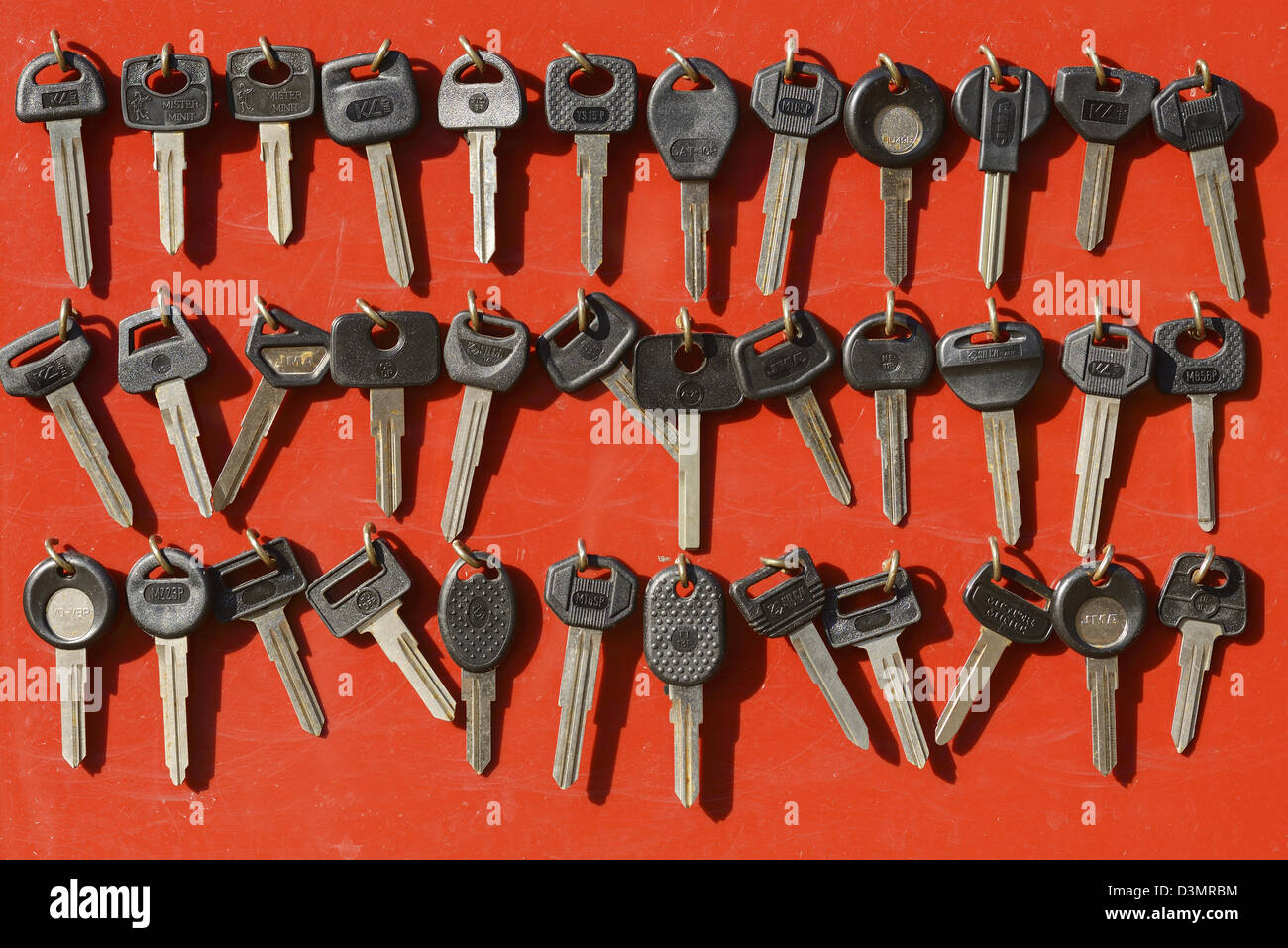 Car keys hanging on hooks Stock Photo