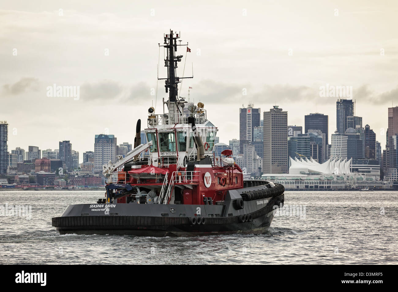 Tugboat crossing Burrard Inlet, Vancouver, British Columbia, Canada Stock Photo