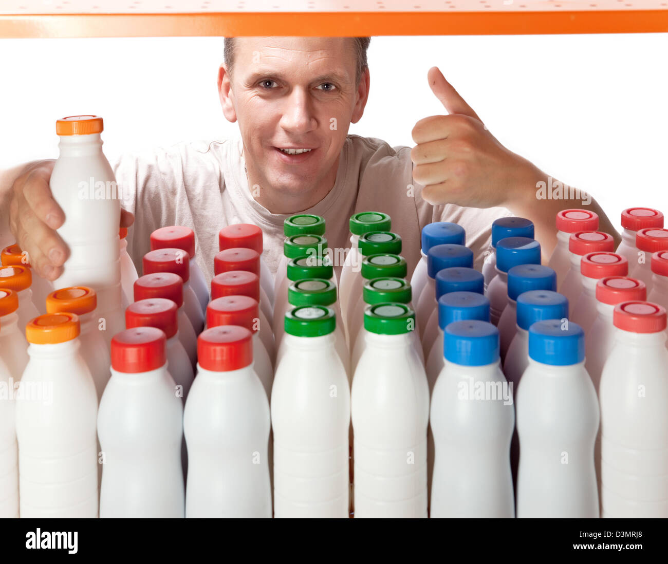 The man selects dairy products in the shop Stock Photo Alamy