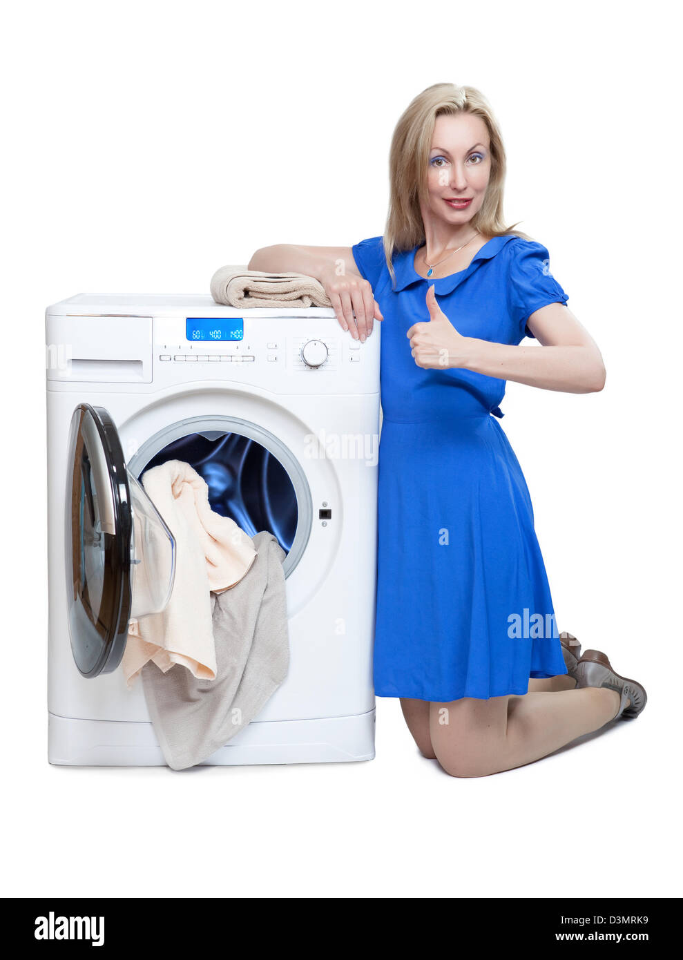 The happy young woman near the new washing machine Stock Photo
