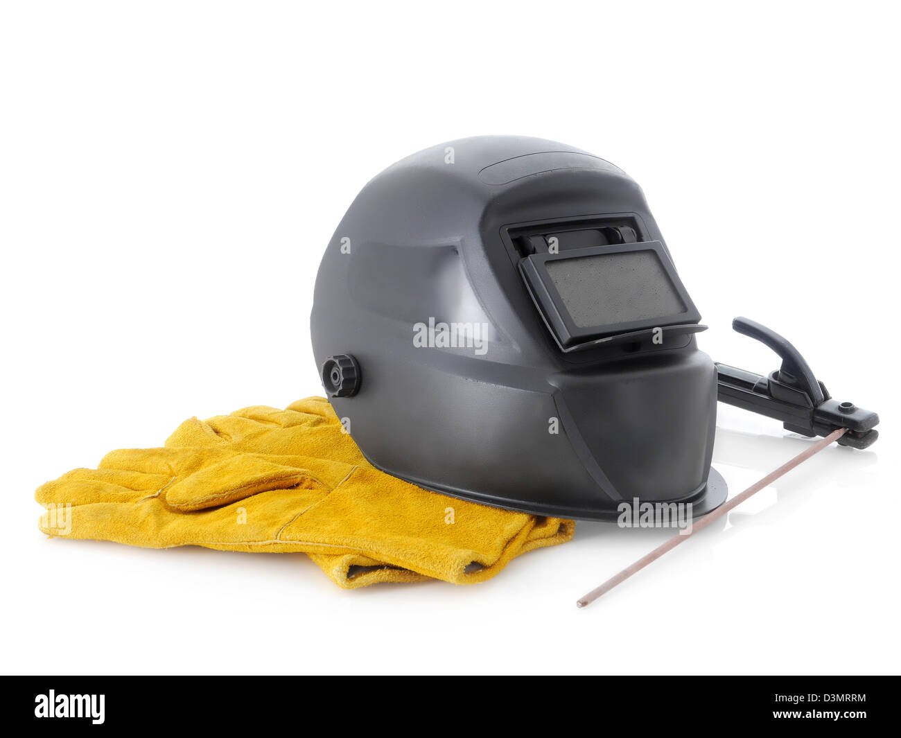 Black welding hood,welding electrode holder and yellow protective leather gloves over white Stock Photo