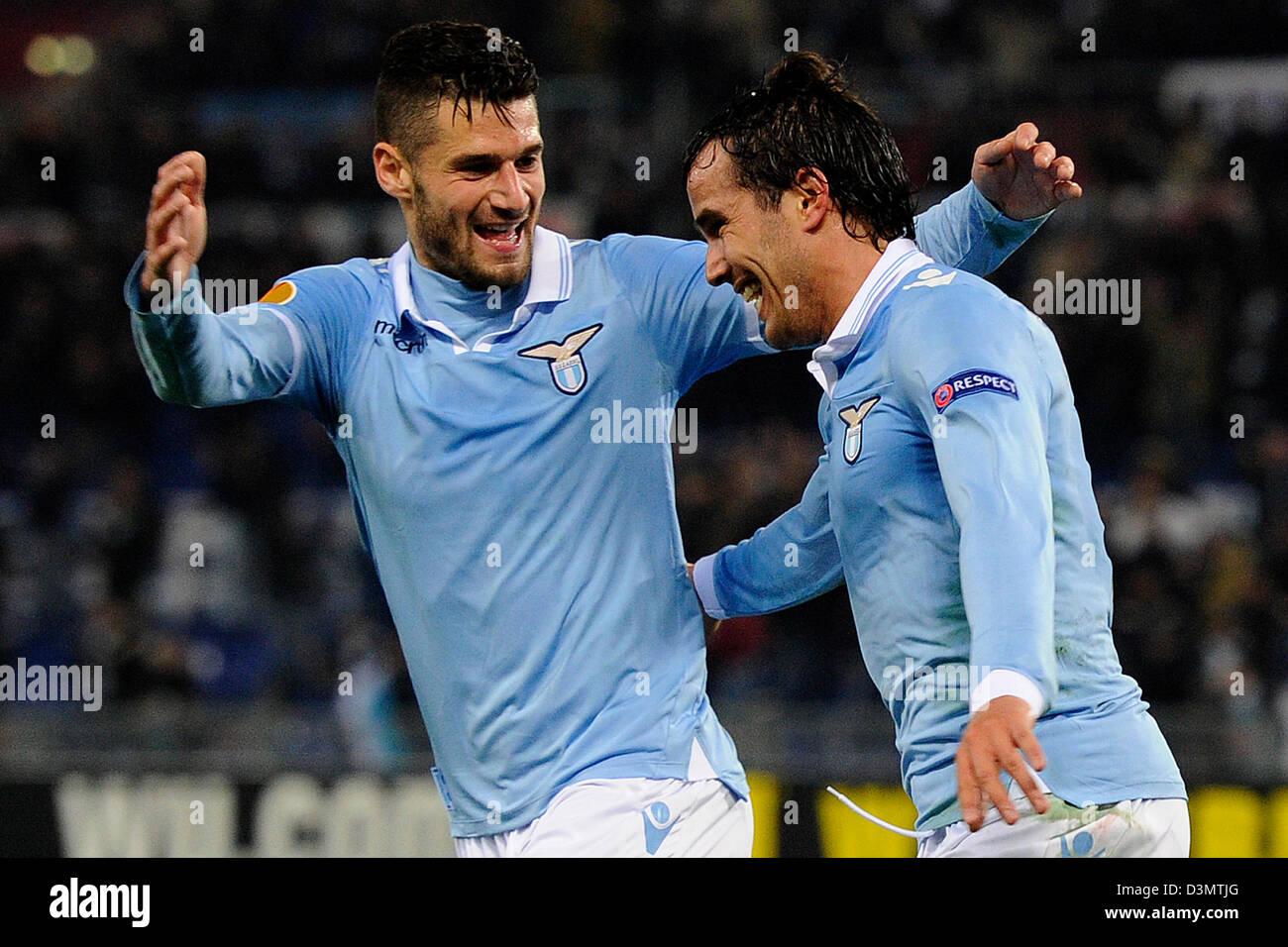 Rome, Italy. 21st February 2013. Lazio's Alvaro Gonzalez (R) celebrates with Lorik Cana after scoring the 2-0 during the UEFA Europa League Round of 32 second leg soccer match between Lazio Rome and Borussia Moenchengladbach at the Olympic Stadium in Rome, Italy, 21 February 2013. Photo: Marius Becker/dpa /Alamy Live News+++(c) dpa /Alamy Live News- Bildfunk+++ Stock Photo